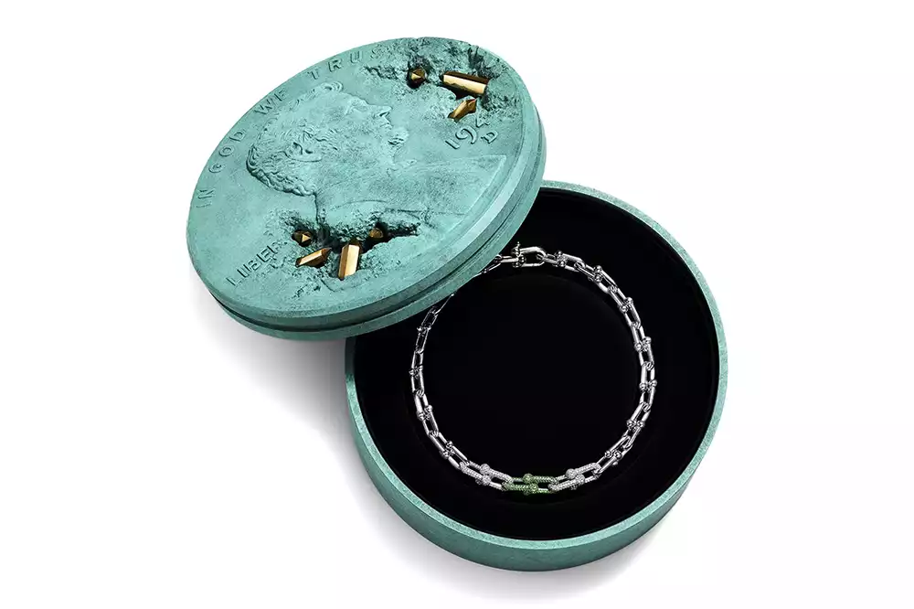 Close-up of the Bronze Eroded Penny Vessel showing the patinated finish