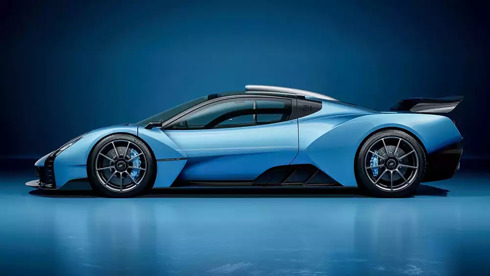 Side profile of the blue Gordon Murray Le Mans GTR, highlighting its longtail aerodynamic shape