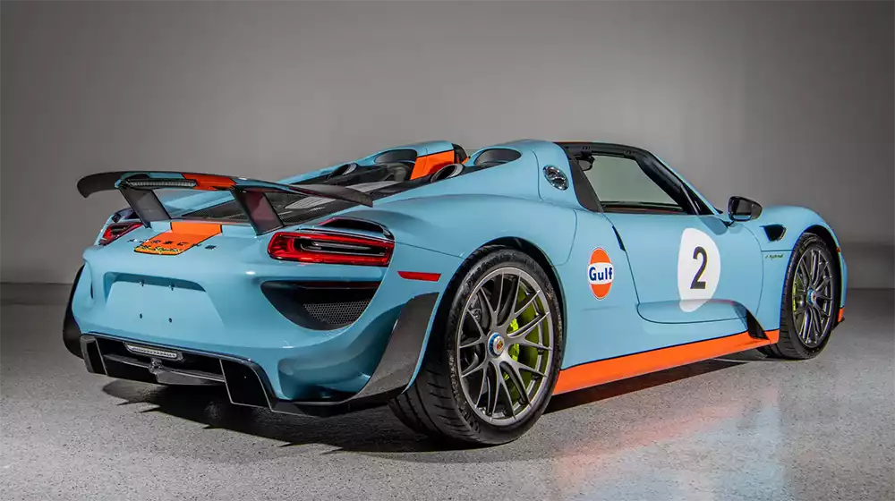 Rear three-quarter view of the Porsche 918 Gulf Spyder with its active rear spoiler deployed