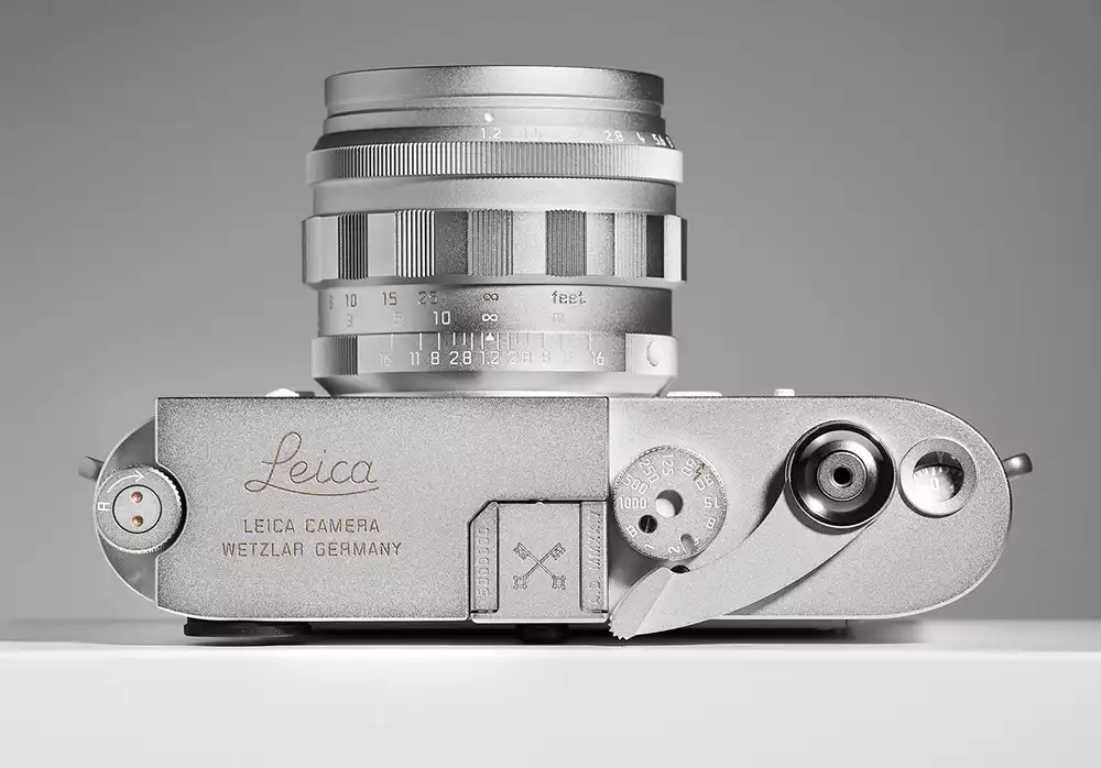Top-down view of the silver chrome Leica M-A and Noctilux-M 50mm f/1.2 lens
