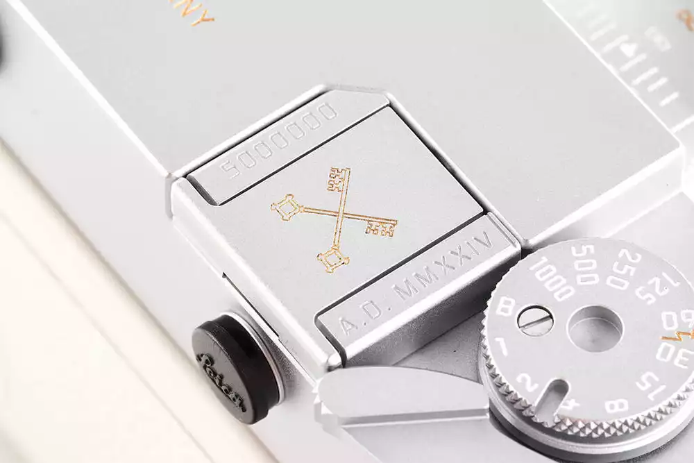 Detail of the gold papal Keys of Peter engraving on the baseplate of the Leica M-A, serial number 5000000