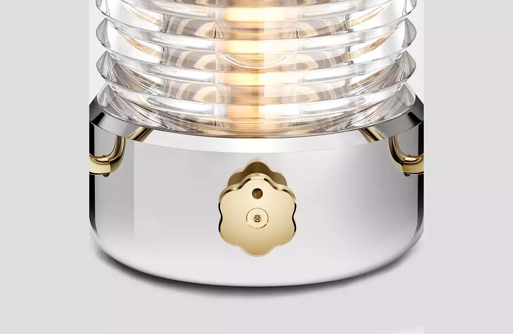 Polished stainless steel and gold hardware detail of the Jony Ive Sailing Lantern