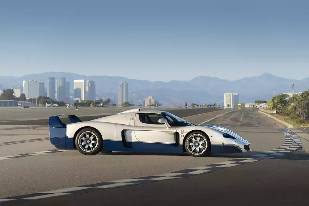 Rear three-quarter view of the Maserati MC12 Stradale highlighting its massive blue rear wing