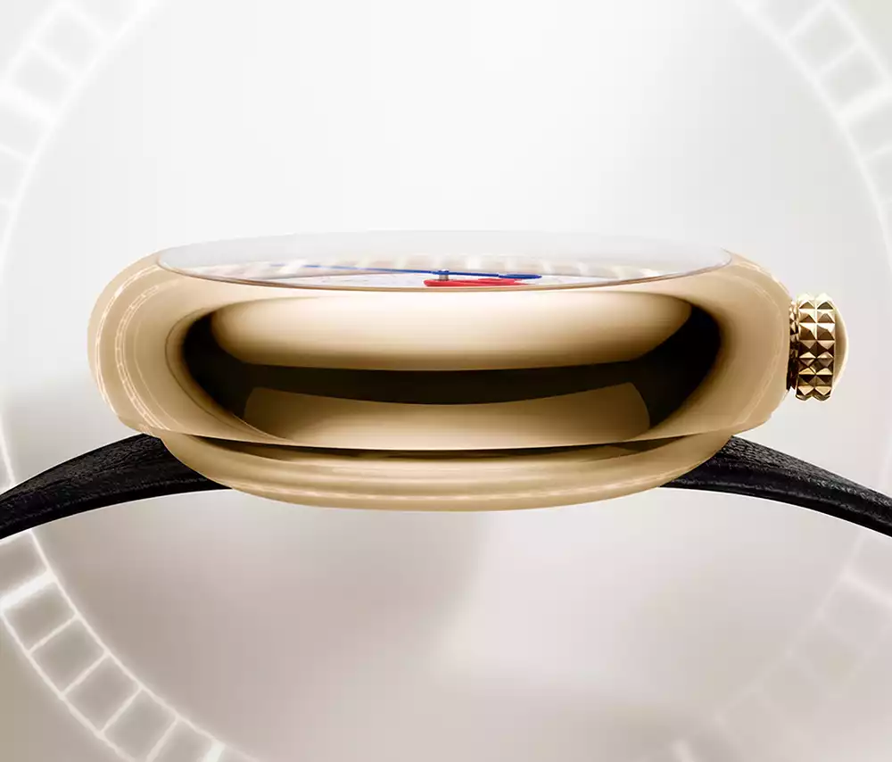 A close-up side profile of the polished 39mm yellow-gold case of the Louis Vuitton Monterey