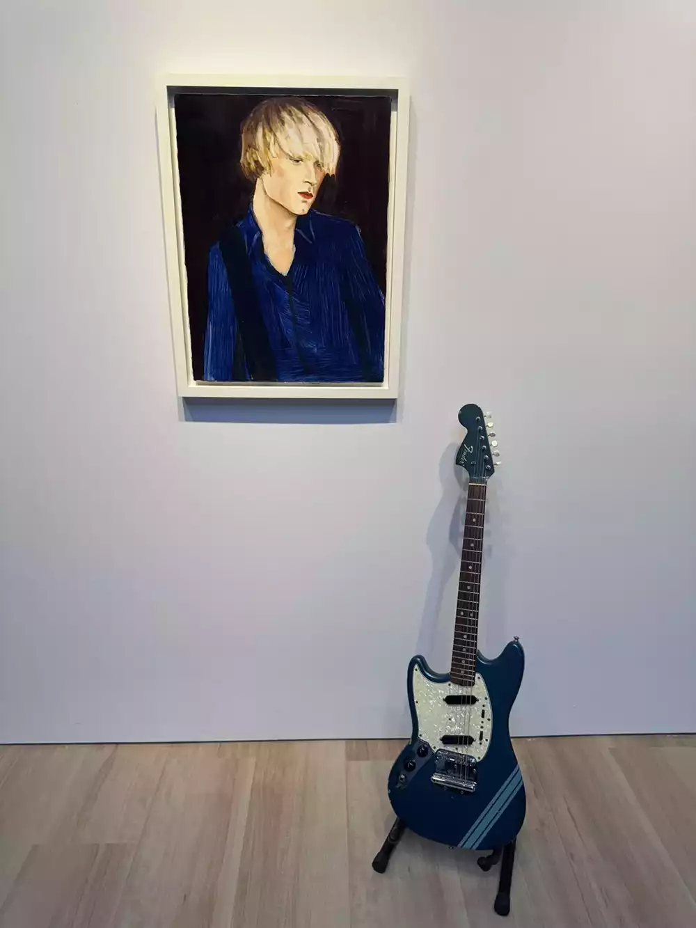Kurt Cobain's Smells Like Teen Spirit guitar displayed at Christie's alongside a portrait