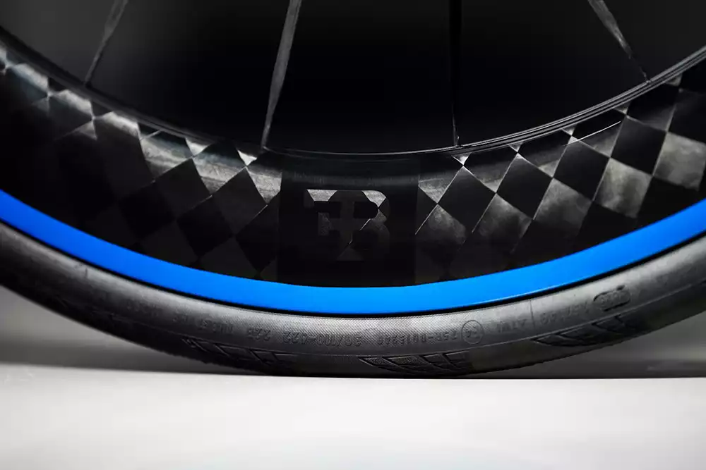 Black Inc Bugatti Hyper 62 carbon wheels with exposed carbon weave finish