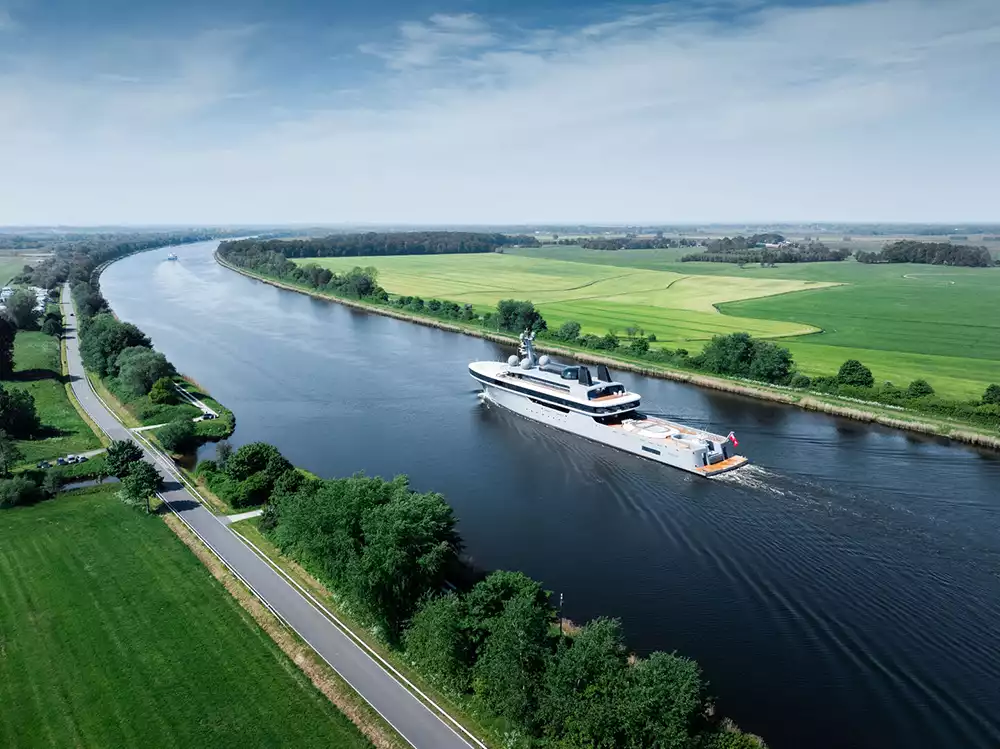 Side profile of 114m luxury yacht Nausicaä sailing in open water
