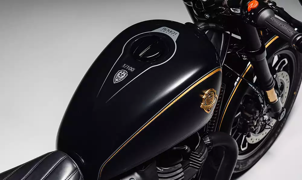 Individually numbered custom badge on the Royal Enfield Shotgun 650 Rough Crafts Edition tank