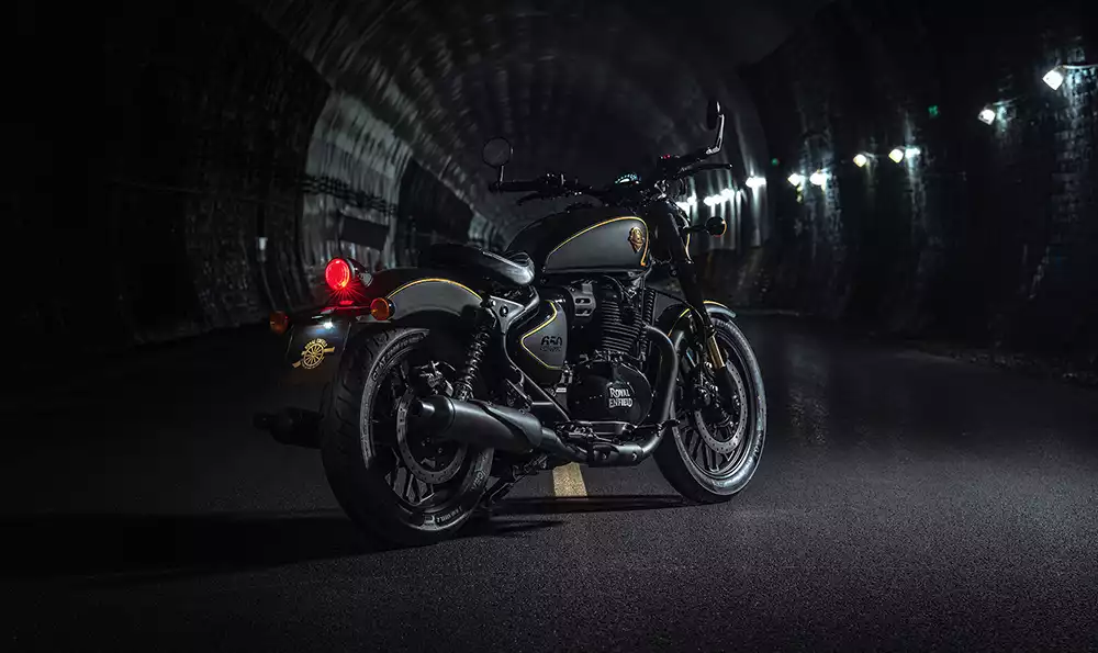 Royal Enfield Shotgun 650 Rough Crafts Edition parked inside a dark illuminated tunnel