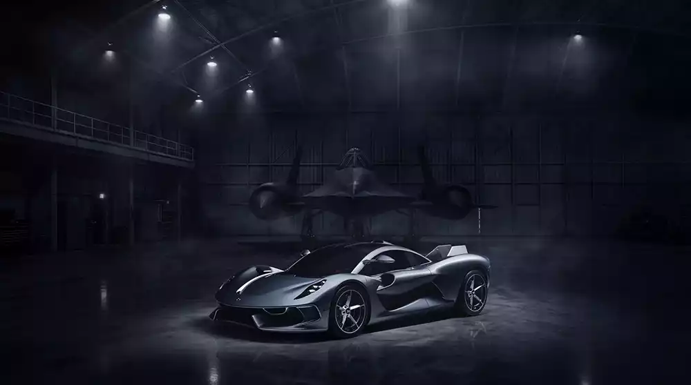 Hennessey Blackbird hypercar parked next to a Lockheed SR-71 Blackbird stealth jet in a hangar