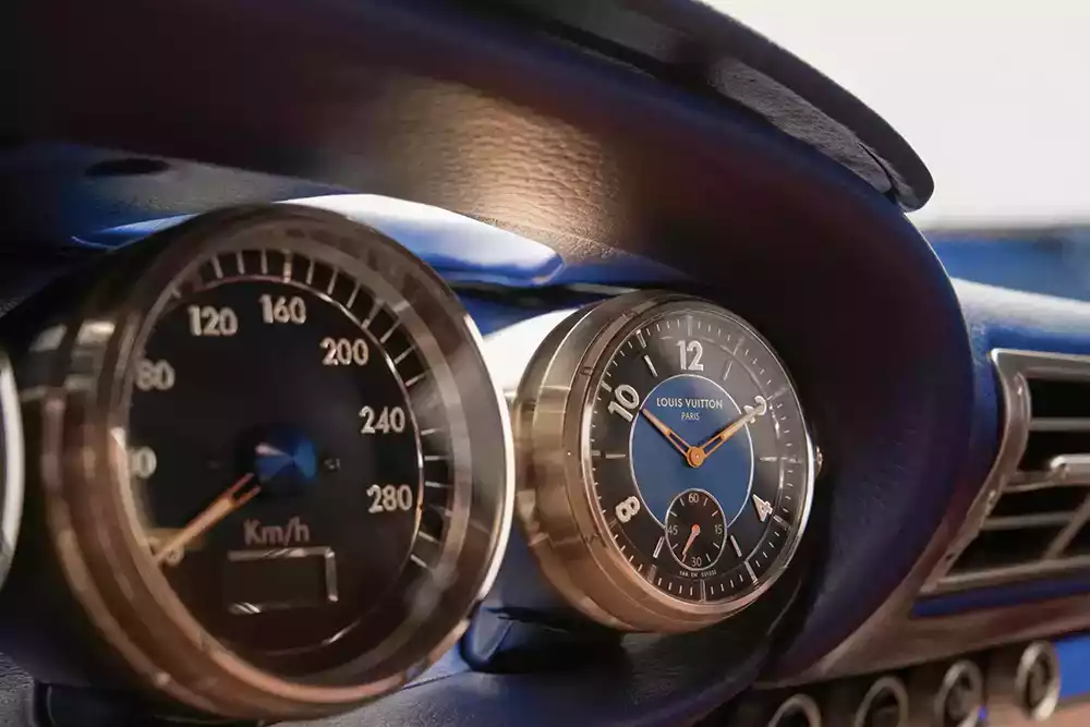 Bespoke Louis Vuitton watch integrated into the dashboard of a Singer Porsche 911