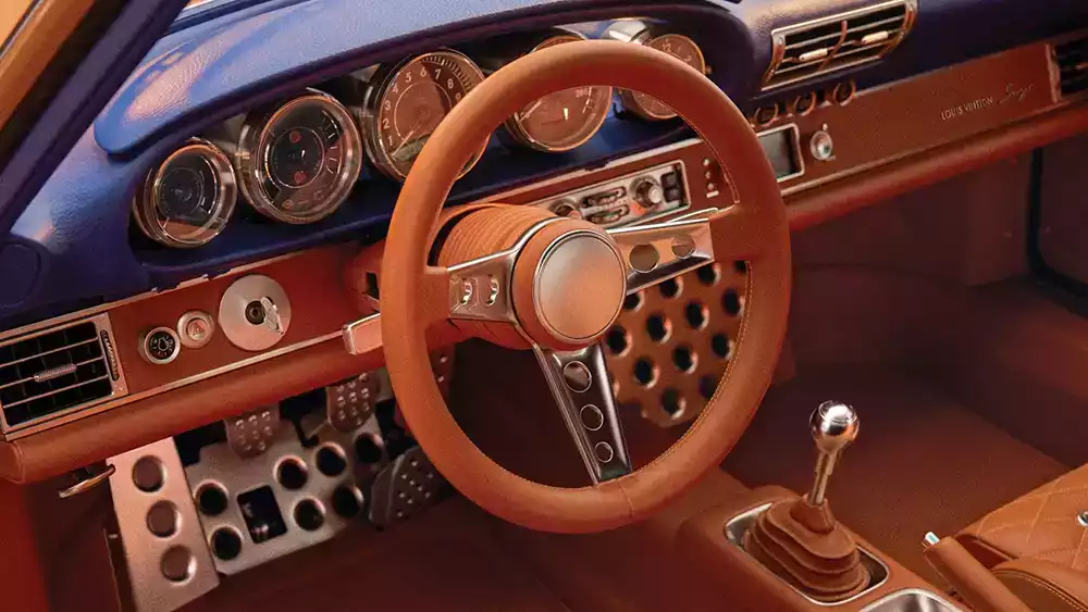 Custom saffron orange leather steering wheel and interior of the Singer Porsche 911 Classic