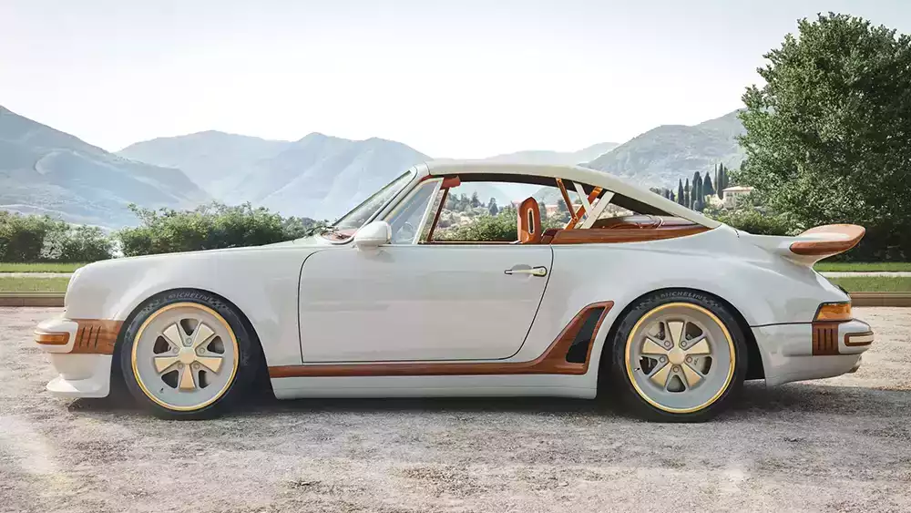 Side profile of the Louis Vuitton x Singer Classic Turbo Cabriolet in the mountains