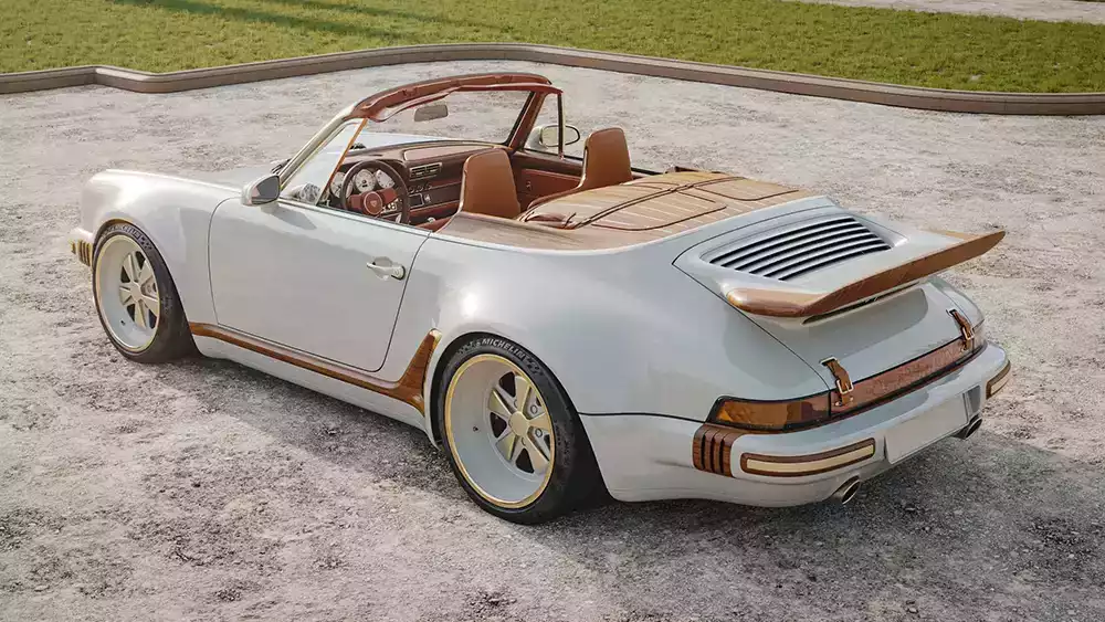 Rear-quarter view of the white Louis Vuitton and Singer Porsche 911 Cabriolet