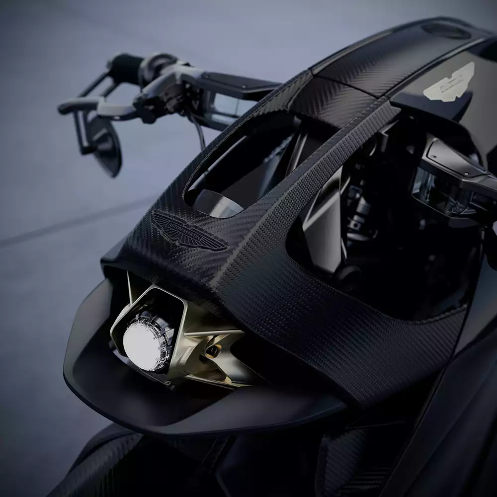 Close up of Aston Martin AMB 002 headlamp and carbon fiber bodywork