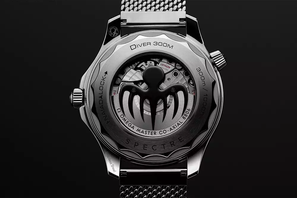 Omega calibre 8806 Spectre sapphire caseback showing automatic rotor with octopus logo
